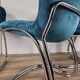 Four 1970s tubular chairs upholstered in blue velvet