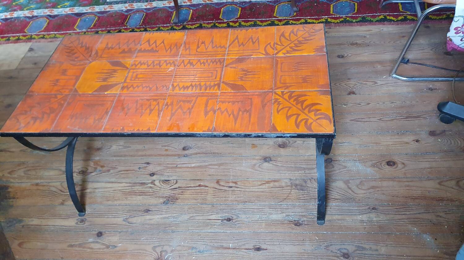 Wrought iron and orange ceramic coffee table