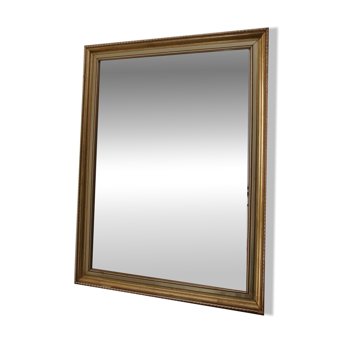 Large beveled mirror in carved wood