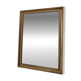 Large beveled mirror in carved wood