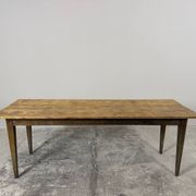 Old farmhouse table with tapered legs, late 19th to early 20th century.