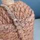 Antique amber glass bottle and hemp carrying bag