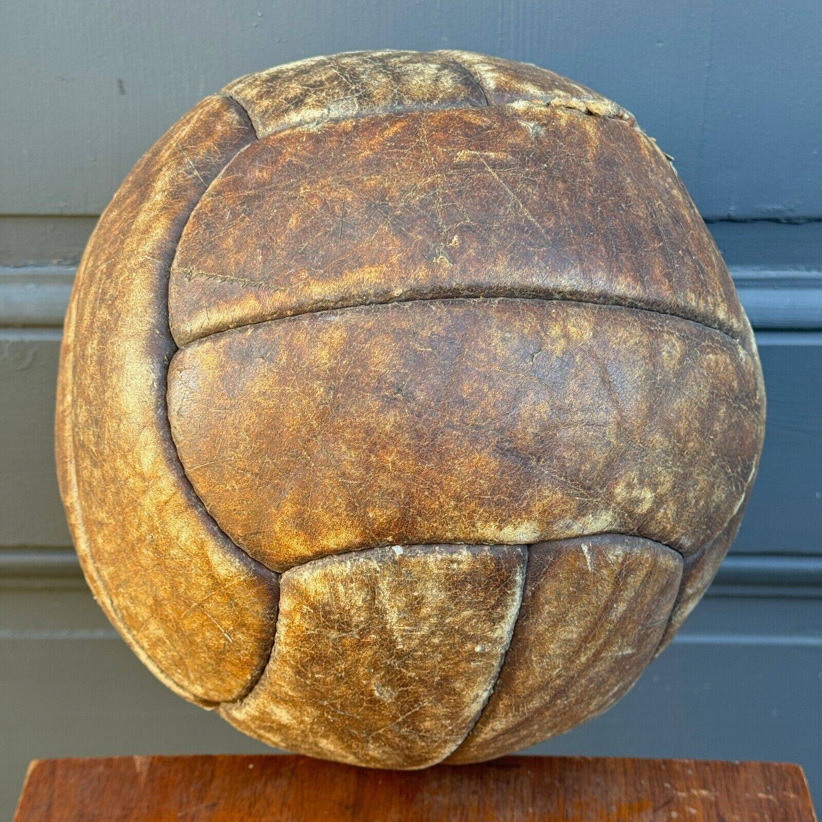 Mid-20th century leather soccer ball with visible stitching and beautiful patina