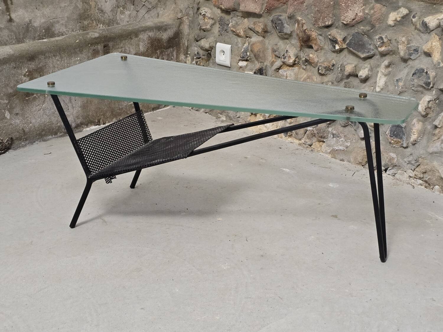 Coffee table in glass and black lacquered metal