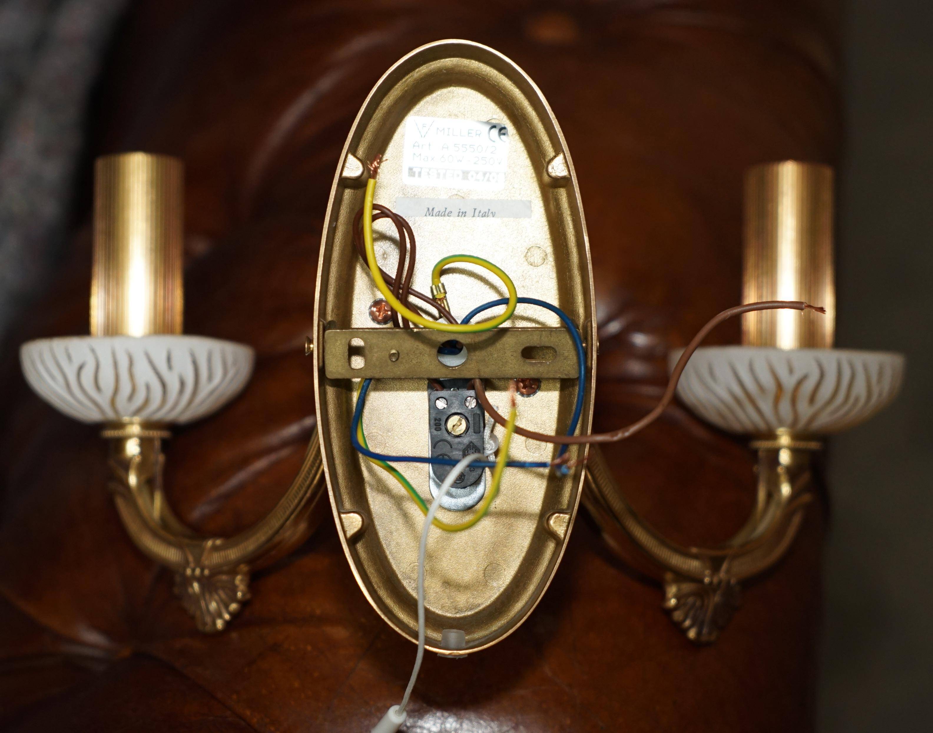 Reccagni wall light pair in brass and frosted glass.