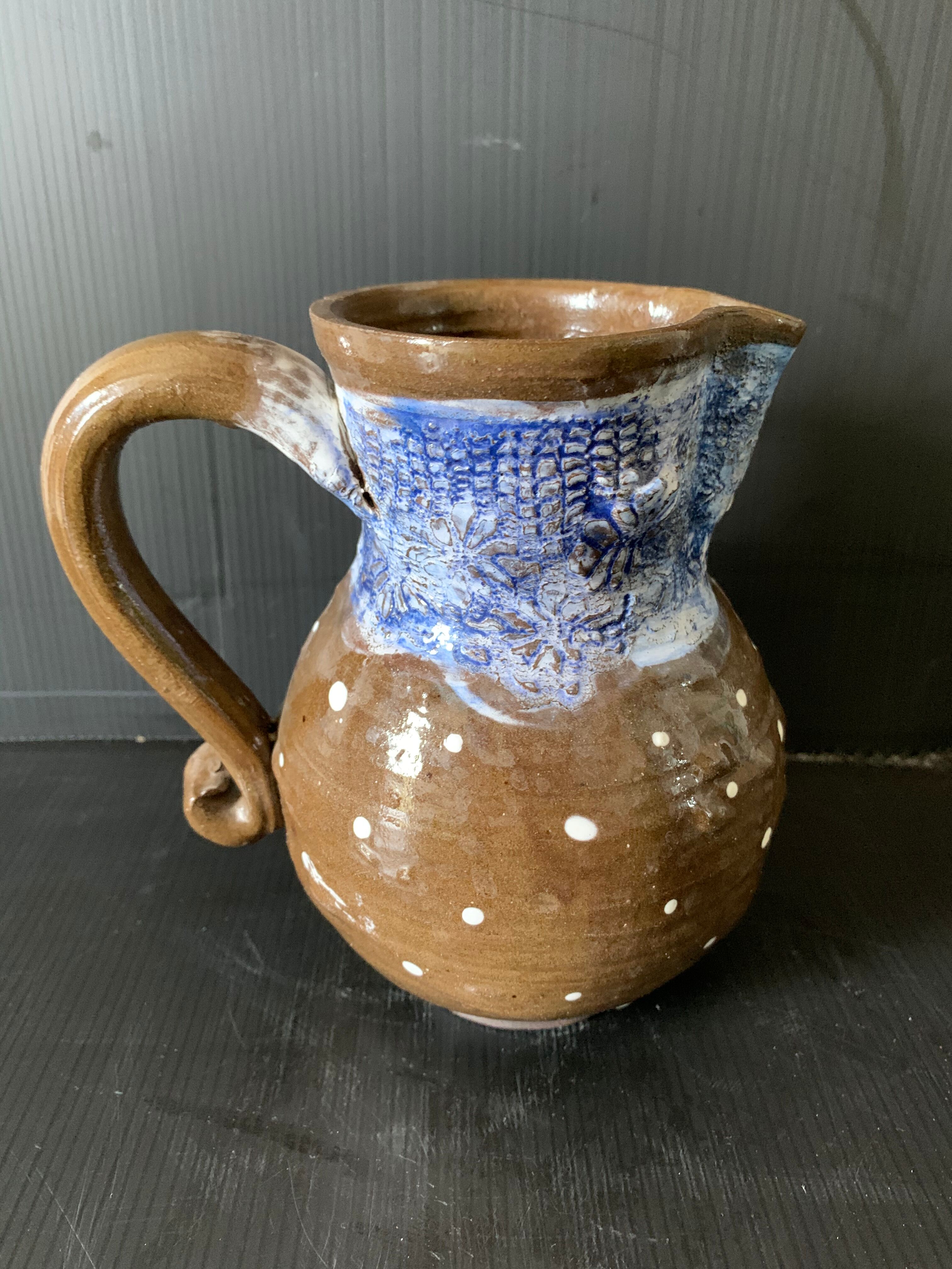 Brown enamelled ceramic pitcher with polka dots