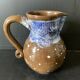 Brown enamelled ceramic pitcher with polka dots