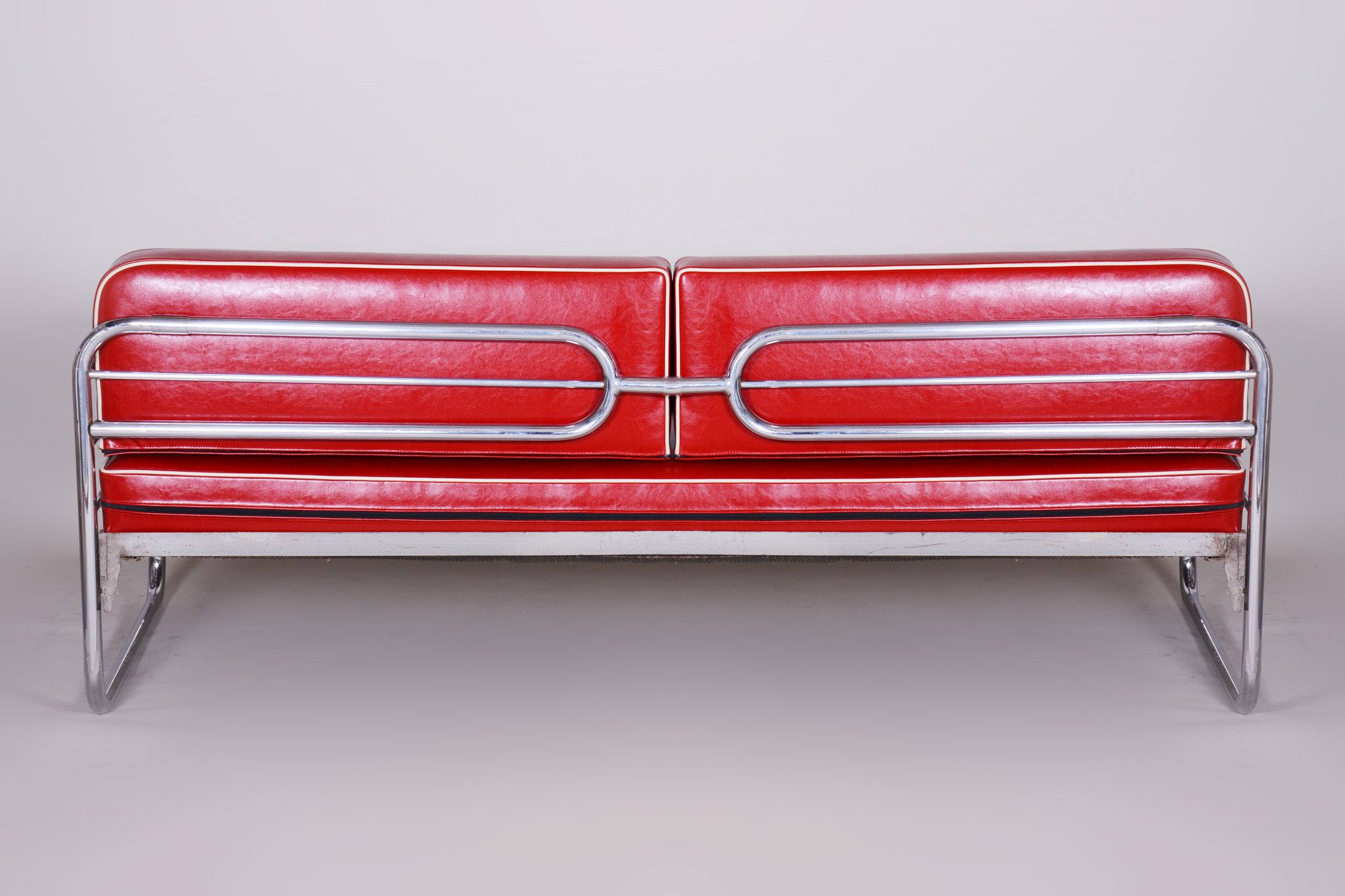 Red leather sofa by Hynekk Gottwald 1930
