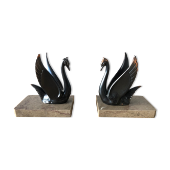 Ancient swan bookend on marble