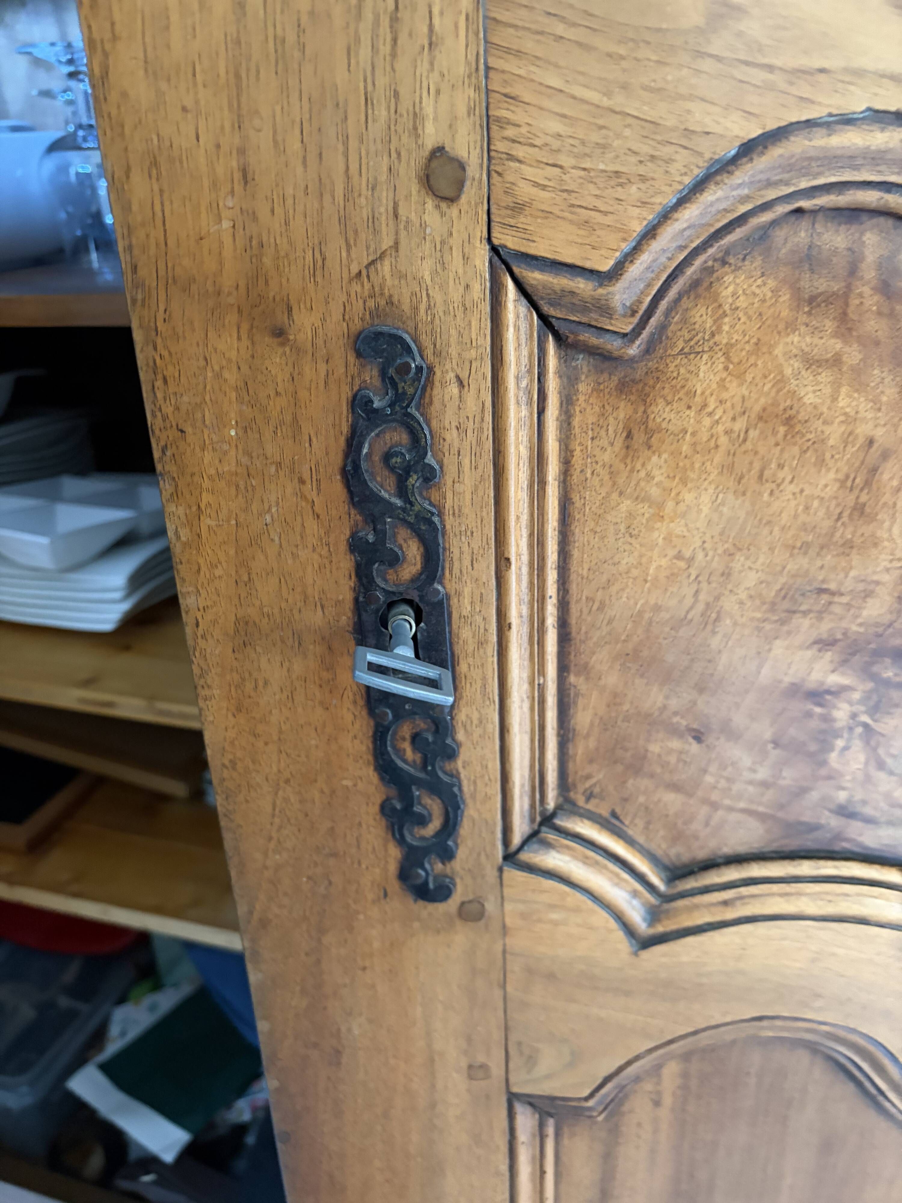 Beautifully decorated walnut wardrobe.