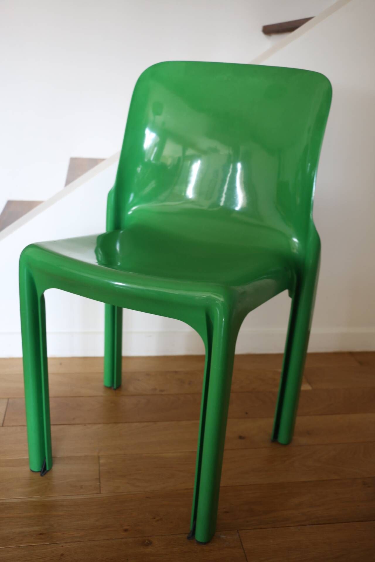 Set of 4 green Selene Magistretti chairs.