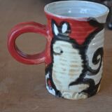 Glazed stoneware mug with snail motif signed