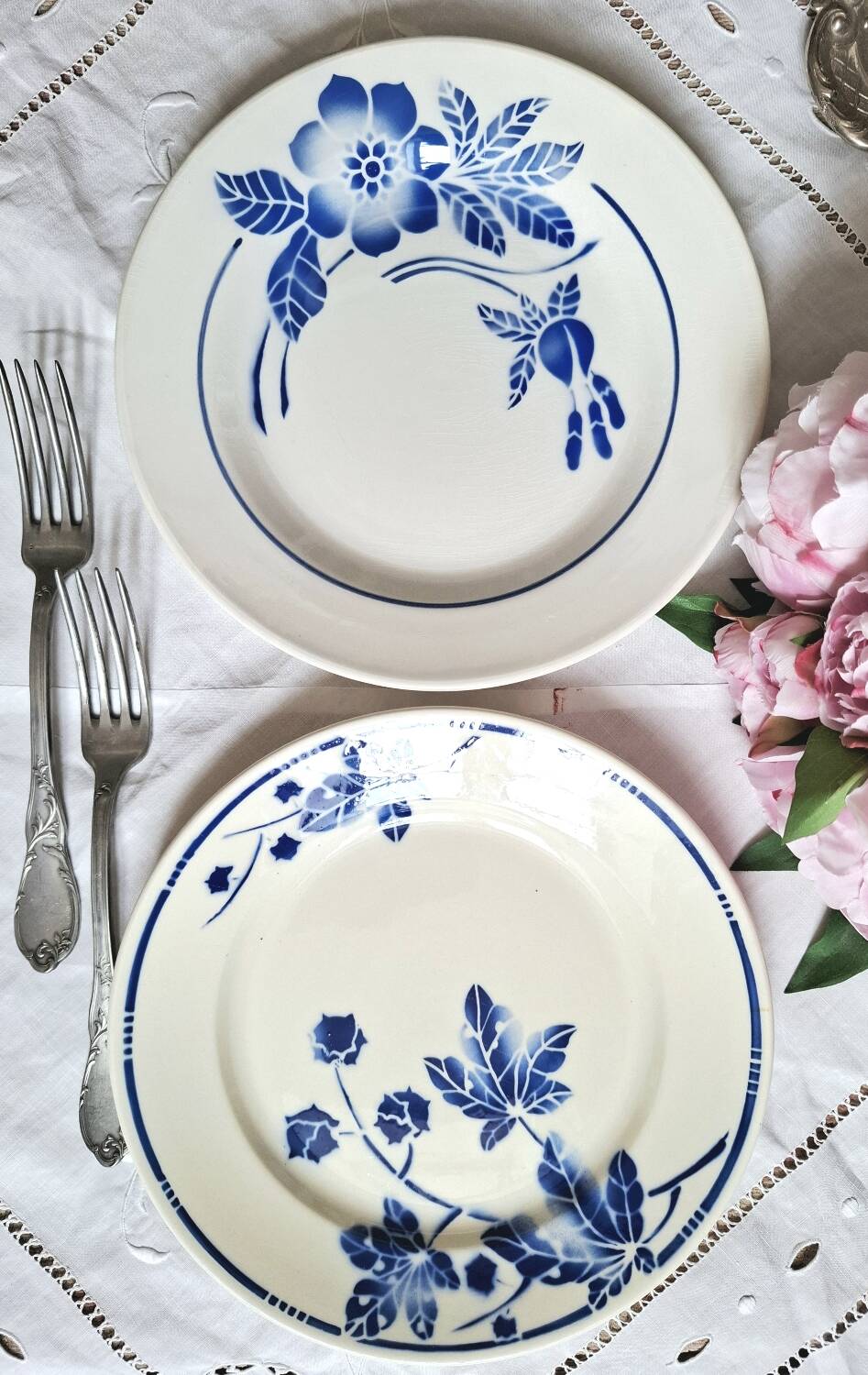 Mismatched antique flat plates accompanied by dishes.