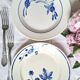 Mismatched antique flat plates accompanied by dishes.