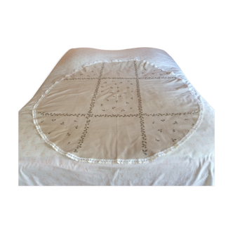 Old embroidered oval tablecloth