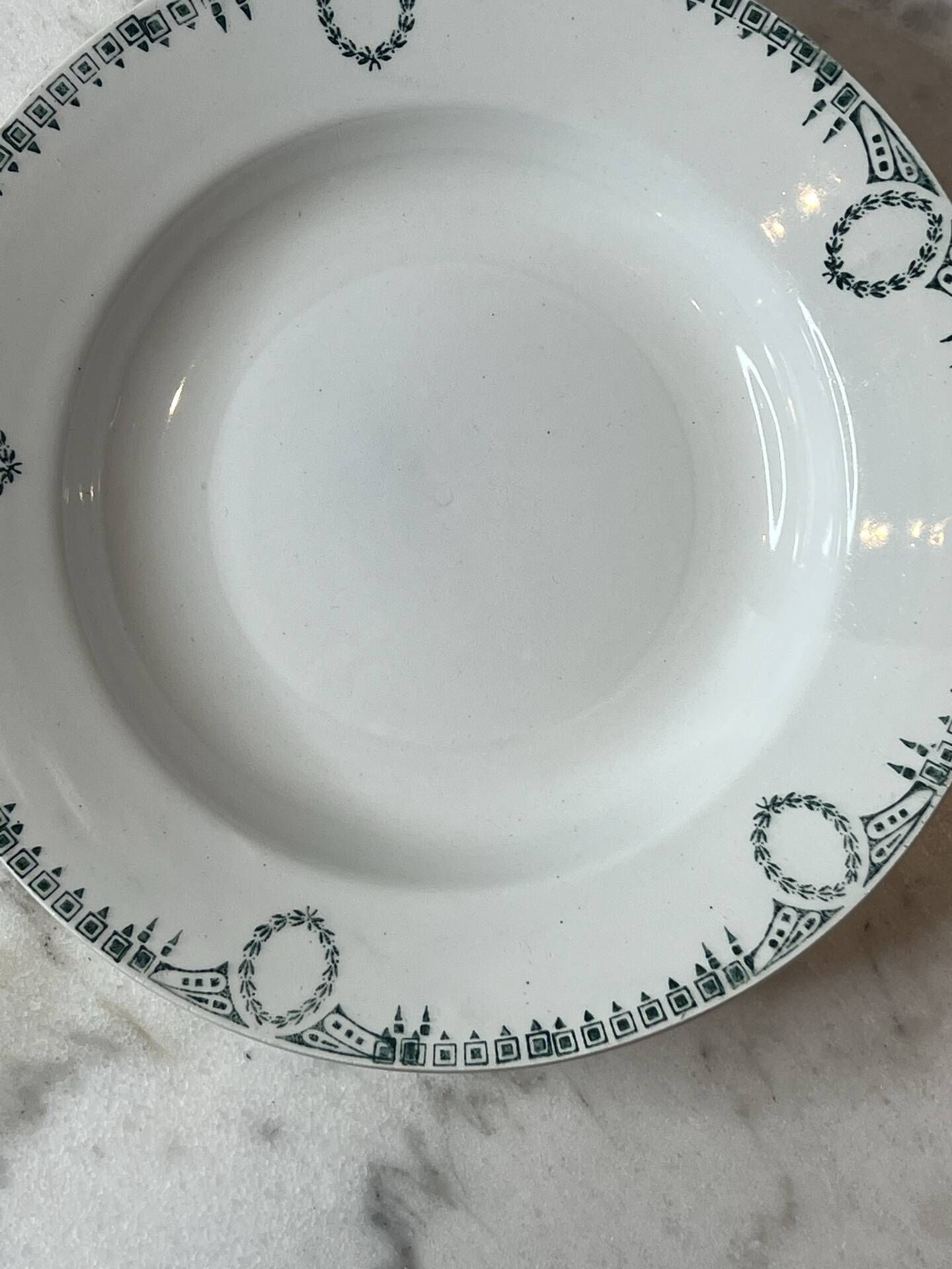Set of 4 deep plates from Saint Amand with laurel wreath decoration.