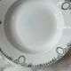 Set of 4 deep plates from Saint Amand with laurel wreath decoration.