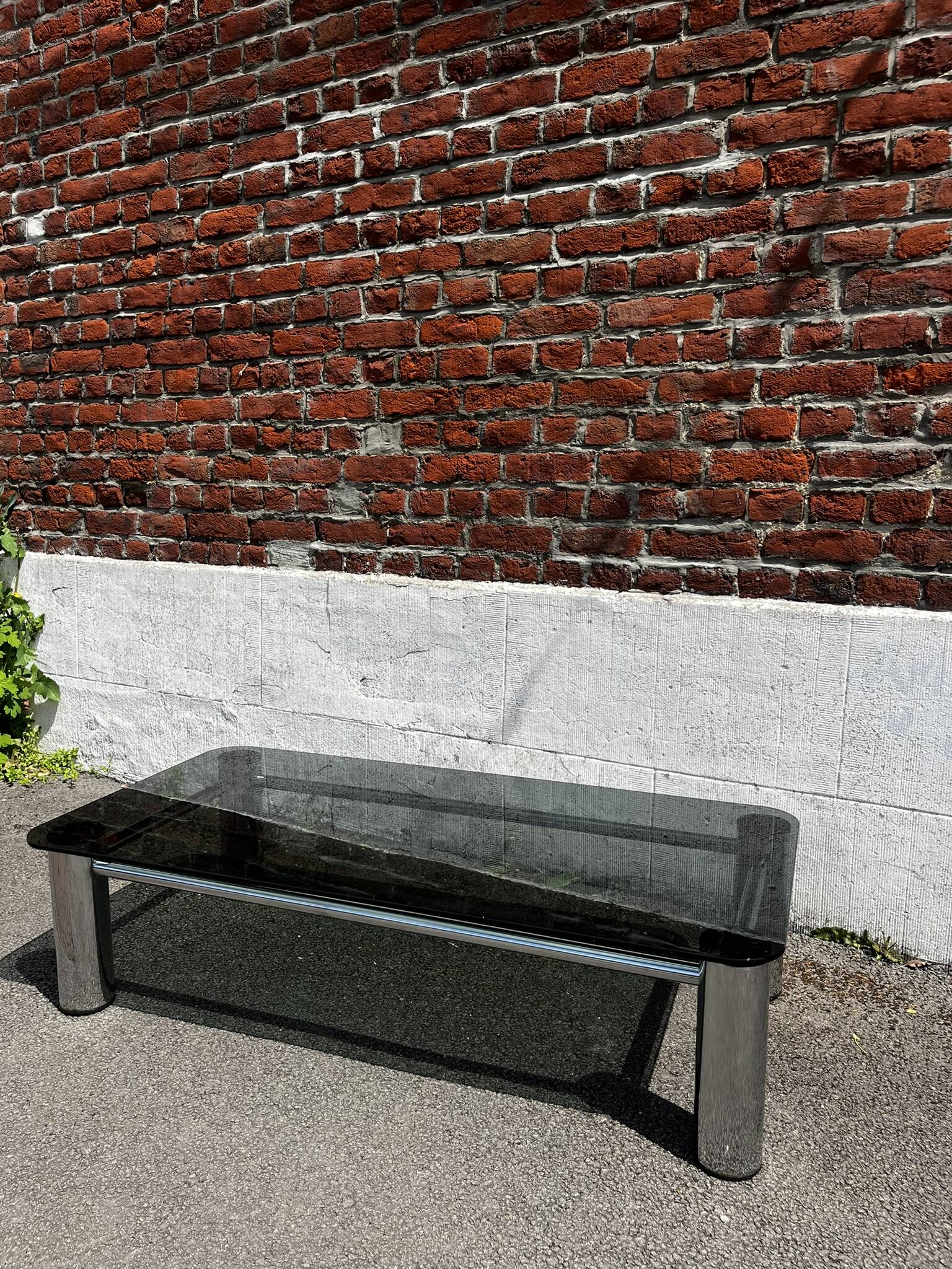 Vintage coffee table with smoked glass and chrome.