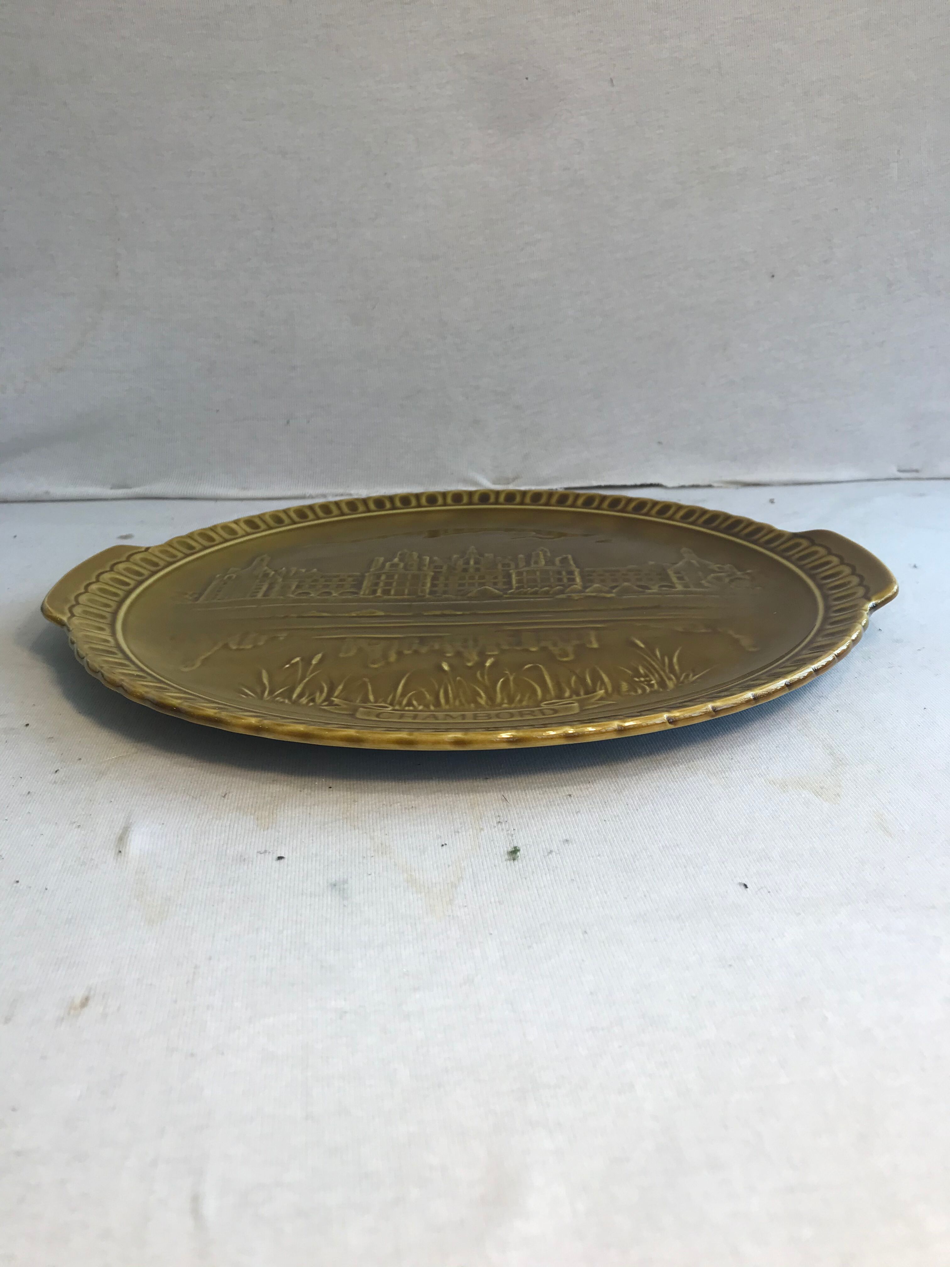 Old dish Gien, drawing chateau chambord in relief and vintage green ceramics