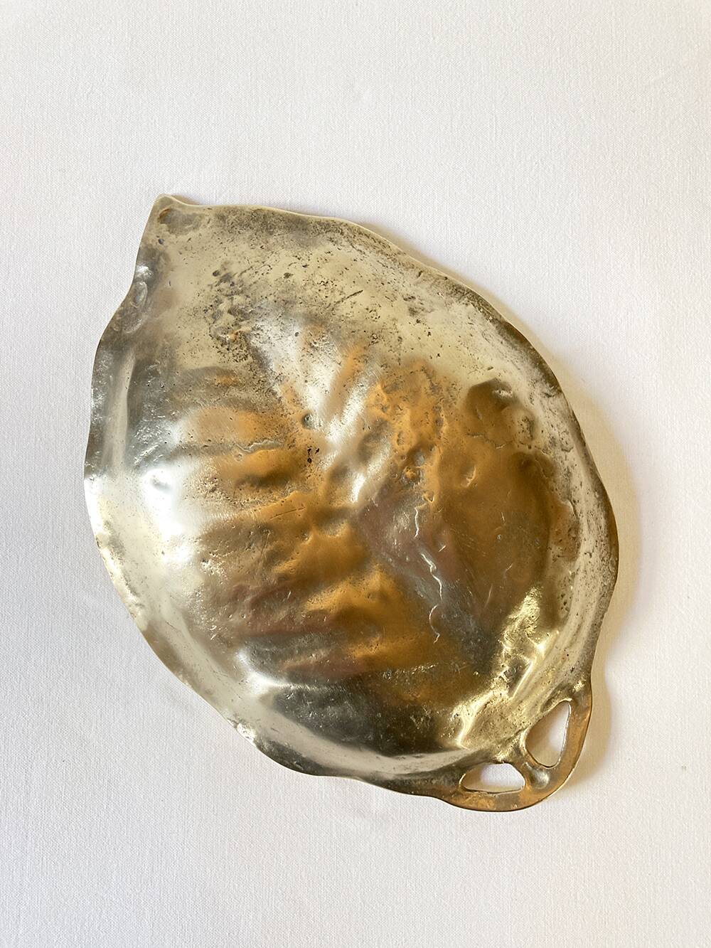 Brass pocket emptier