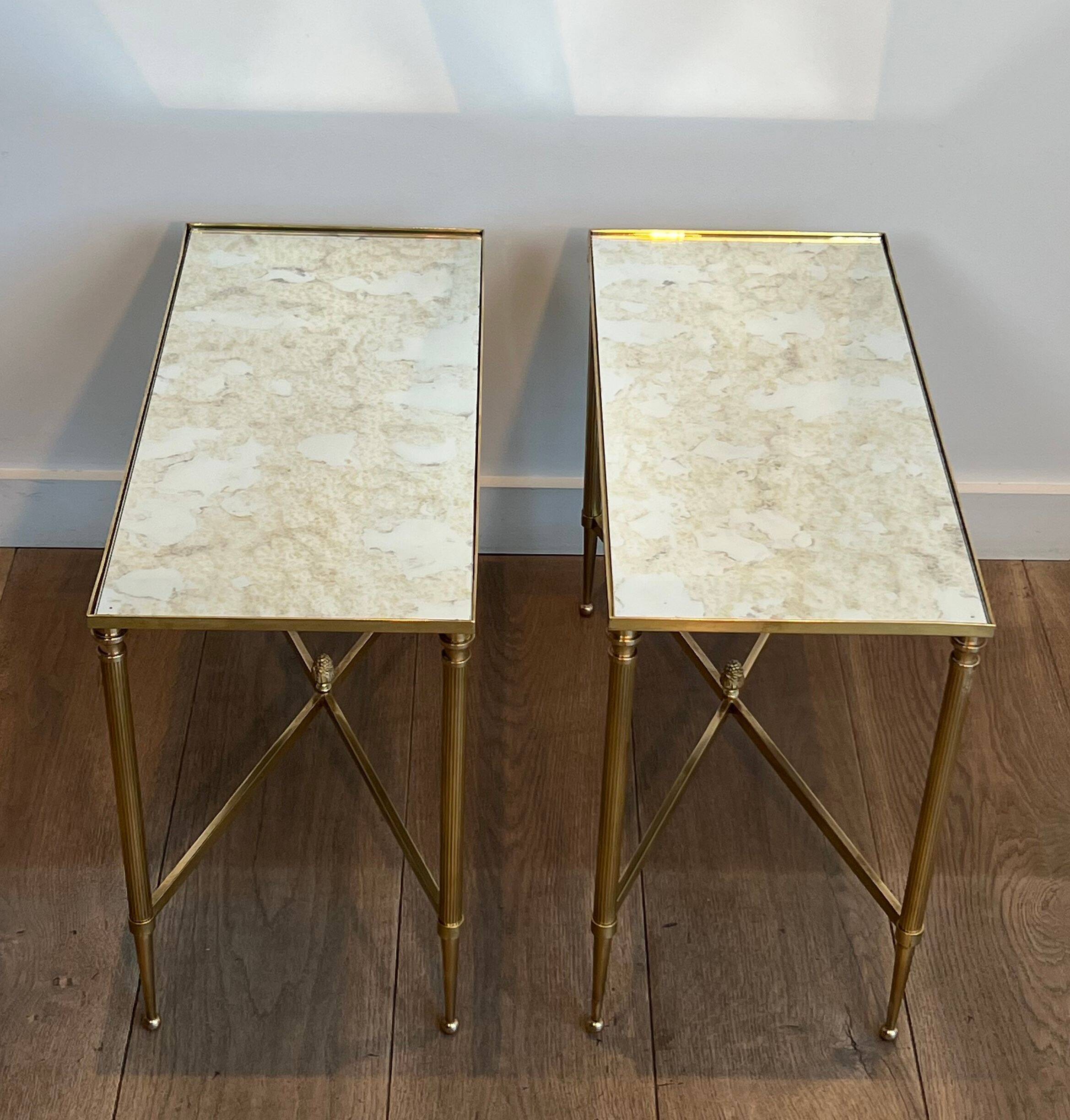 Pair of brass side tables with antique mirrored tops from Maison Jansen
