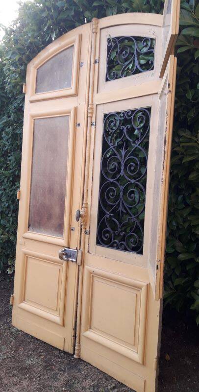 19th century double arched entrance door in oak with grilles and old glass