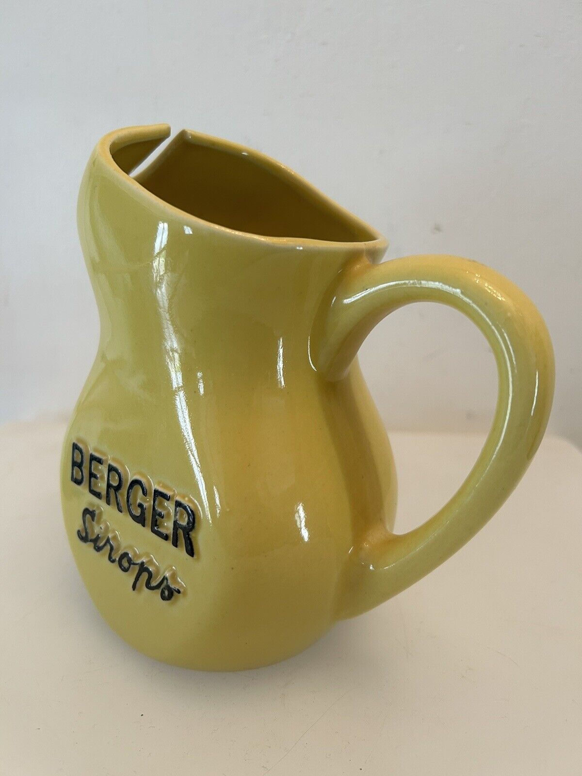 Old yellow pitcher anisette berger syrups, vintage bistro decoration