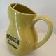 Old yellow pitcher anisette berger syrups, vintage bistro decoration