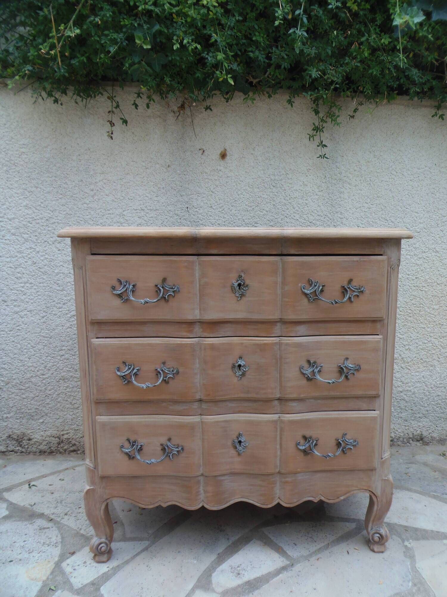 Beautifully crafted Louis XVI style commode in bleached wood.