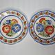 Pair of Henriot Quimper plates decorated with flower, 24 cm