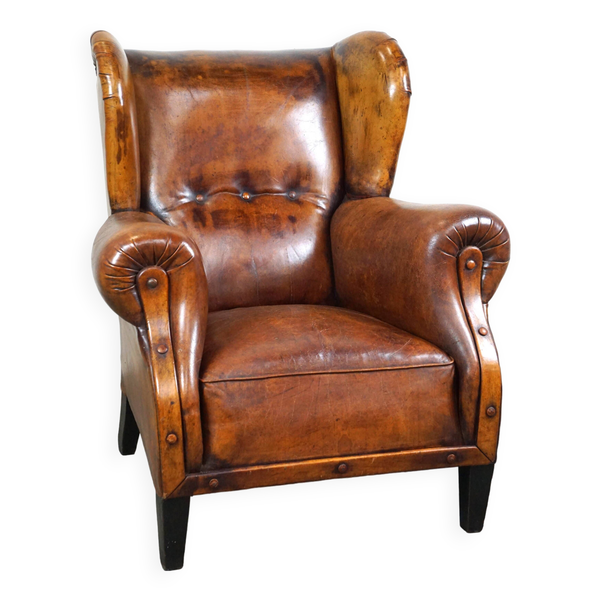 Irresistible old sheep leather wingback armchair with the most beautiful colors