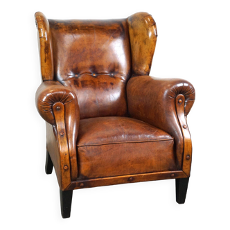 Fauteuil à oreilles en cuir de mouton ancien aux plus belles couleurs