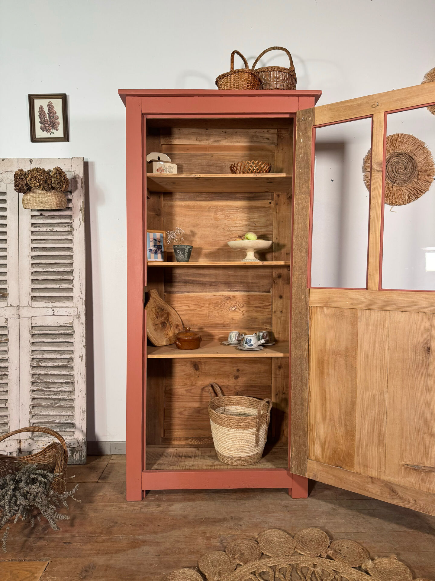 Antique glass-fronted terracotta cupboard