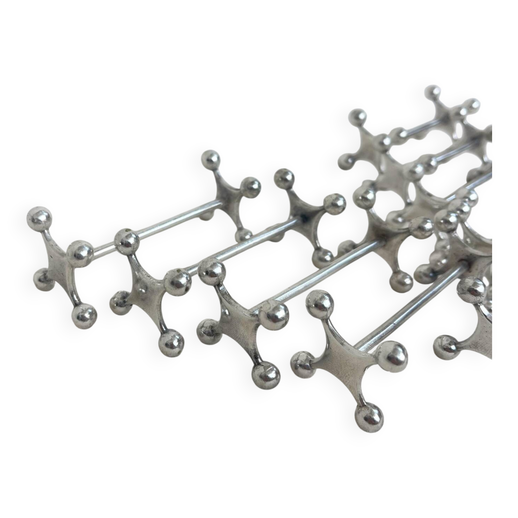 series of brutalist and sculptural silver-plated knife rests