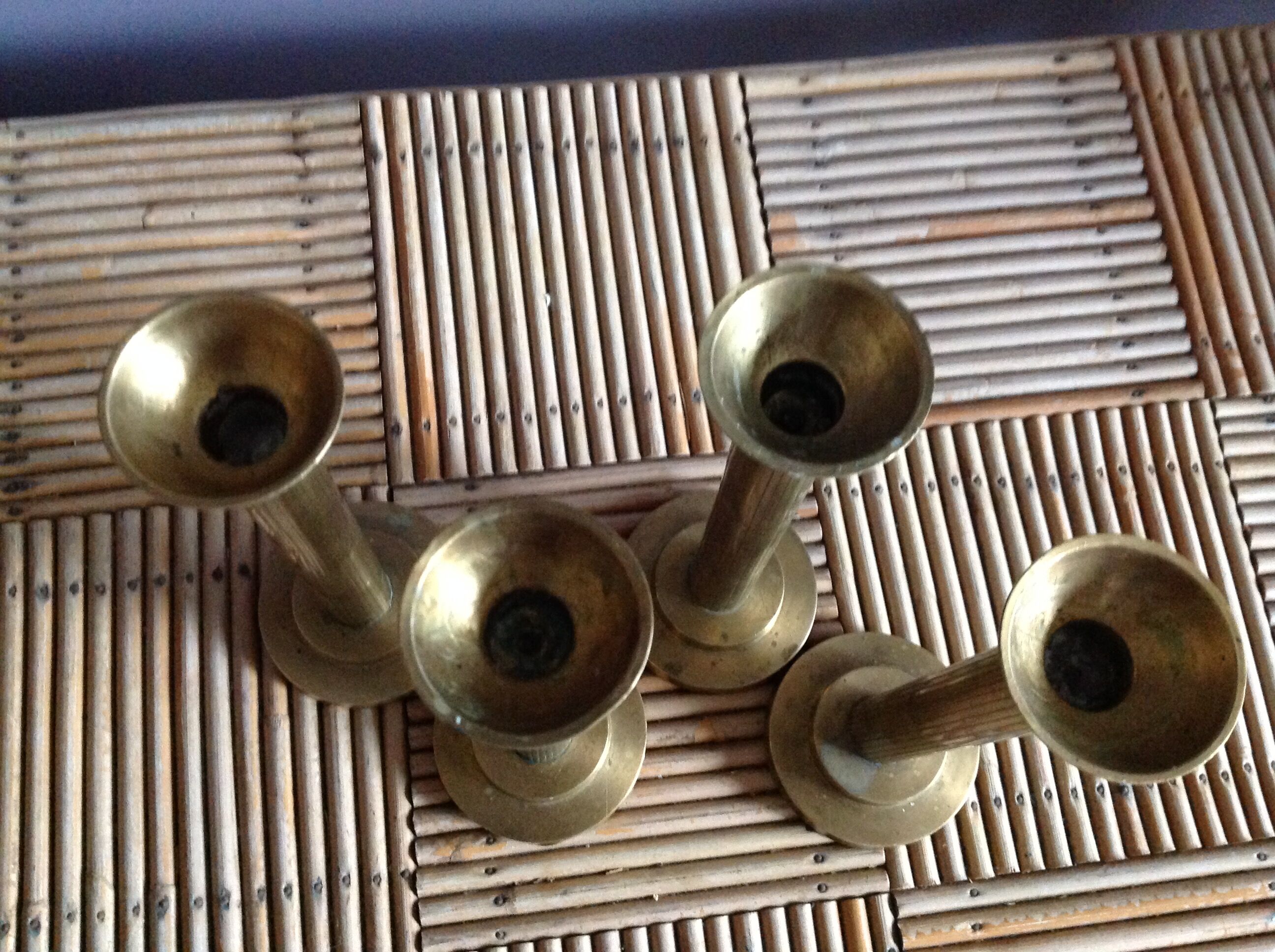 Series of 4 brass candlesticks