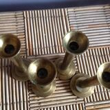 Series of 4 brass candlesticks
