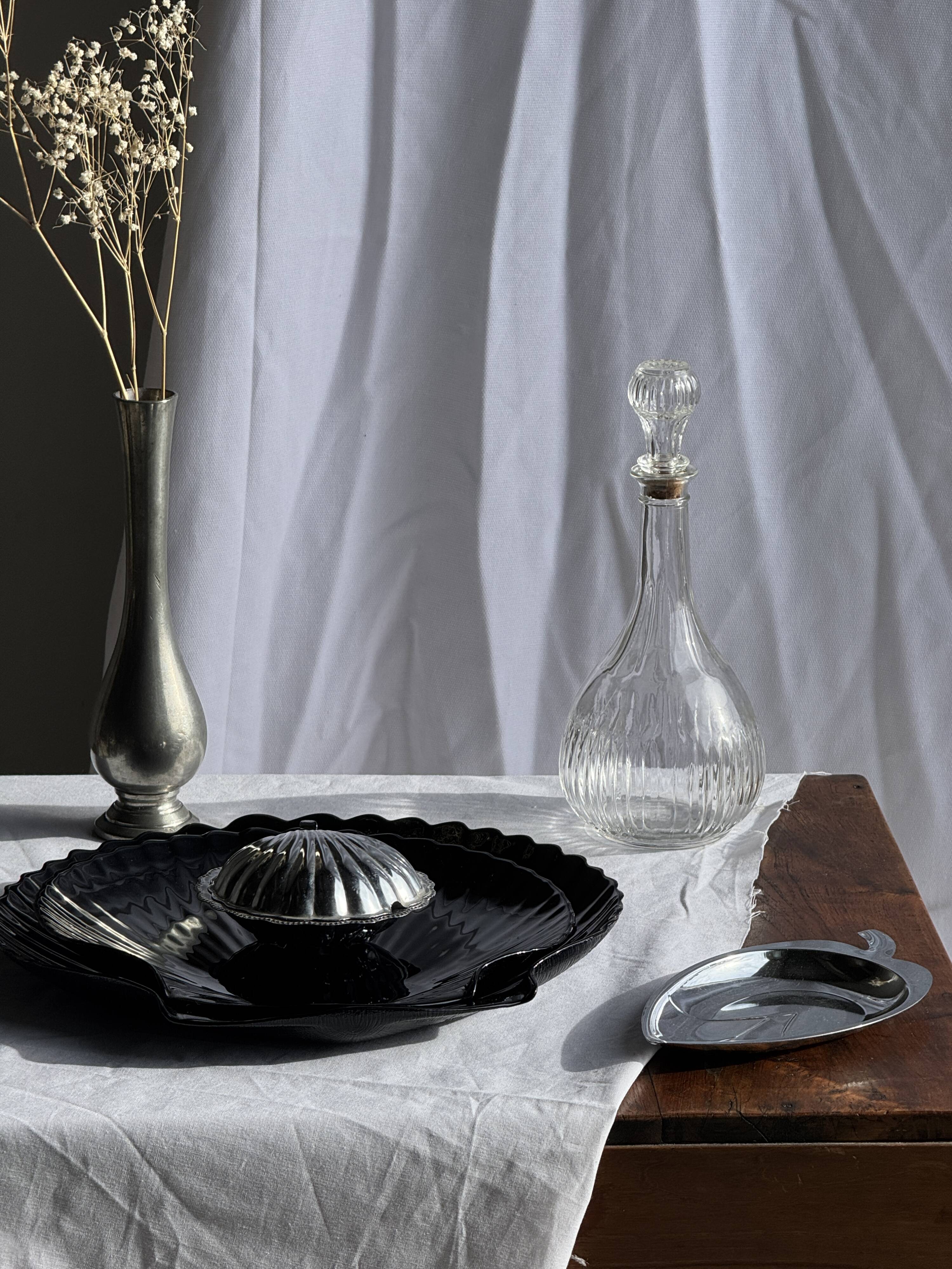 Pair of vintage black glass shell dishes D32 and D26