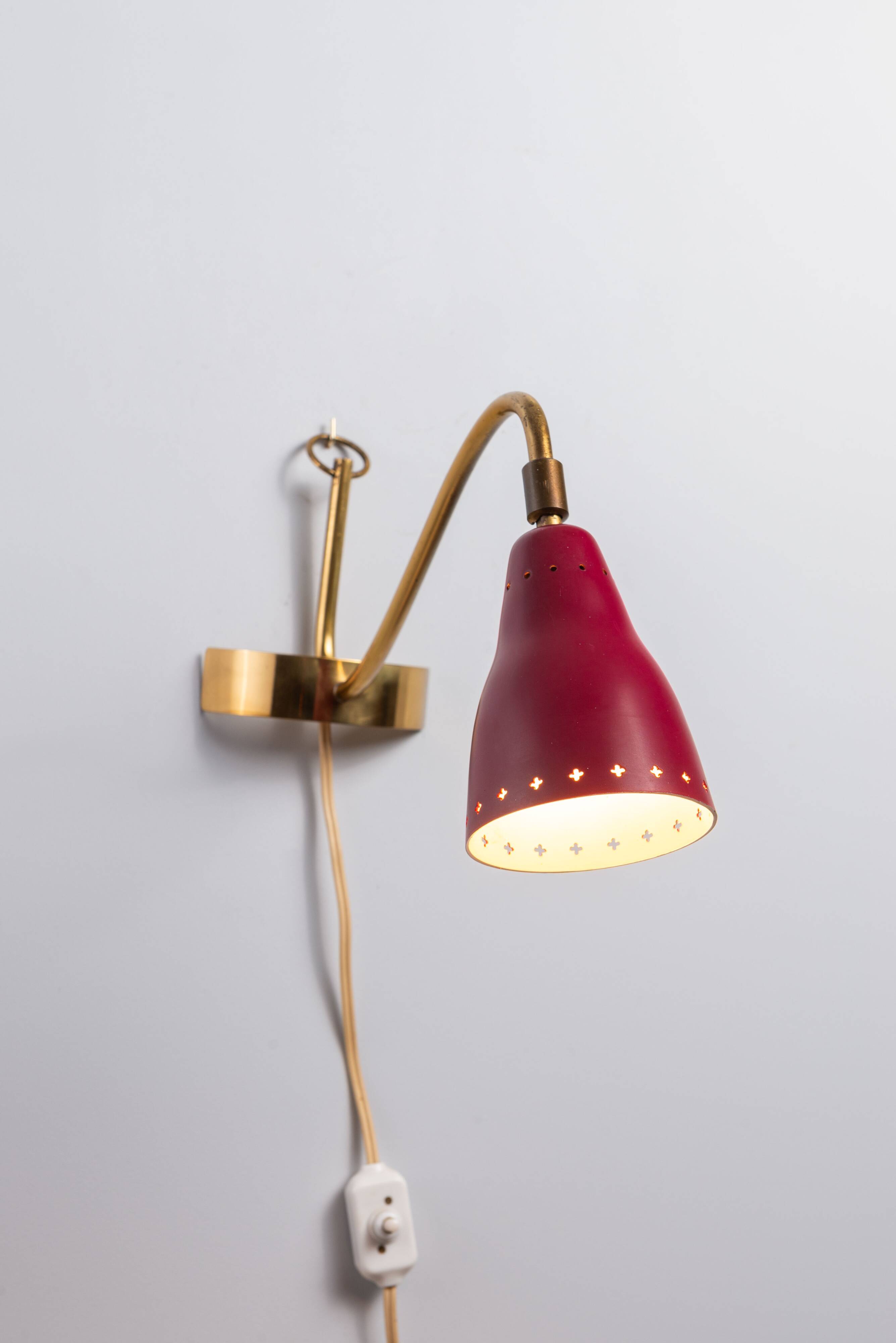 Brass wall lamp with perforated metal shade, 1950s, Sweden