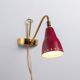 Brass wall lamp with perforated metal shade, 1950s, Sweden