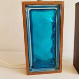 Two Swedish table lamps in solid pressed blue glass and teak wood "frame".