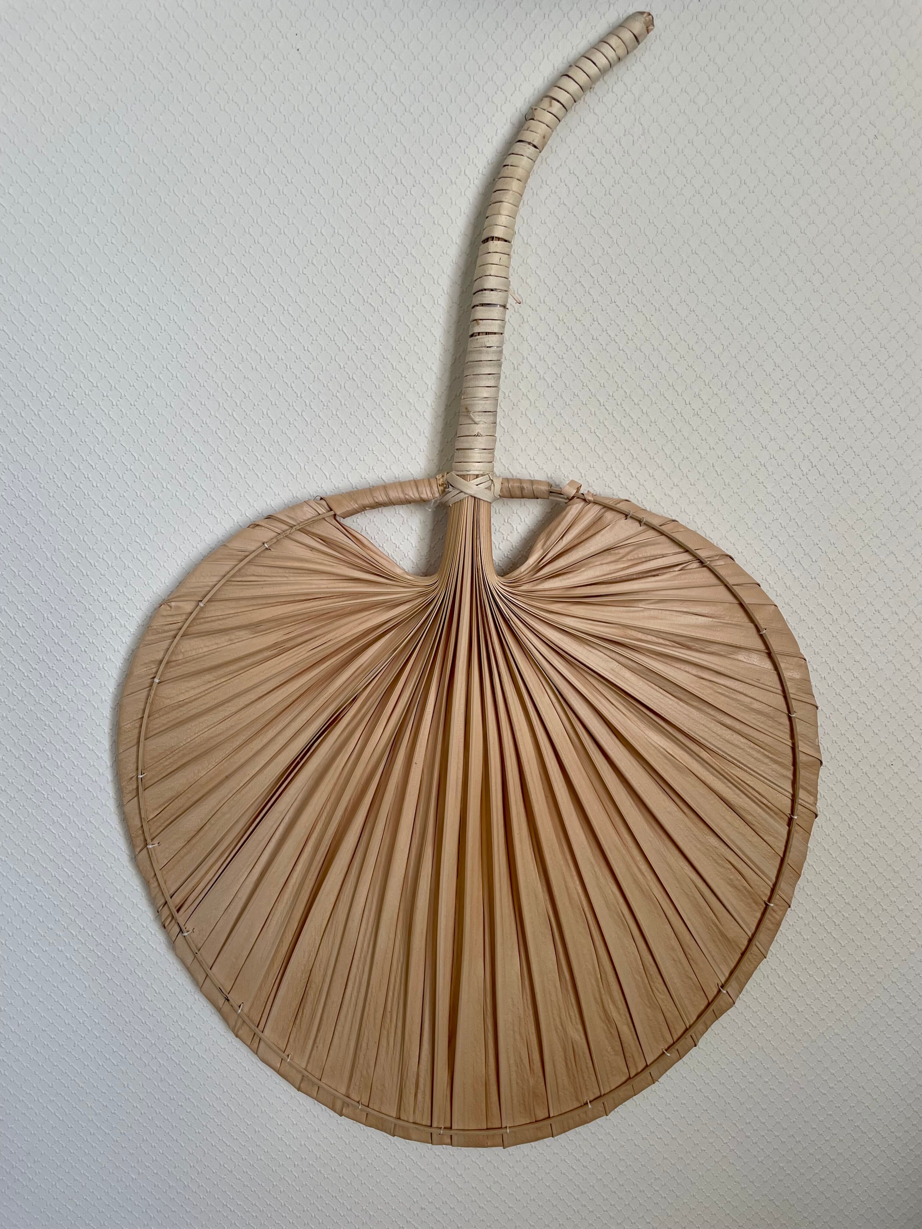 Braided palm leaf fan shape