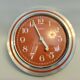 Old orange aluminum clock Manufrance Saint-Etienne
