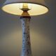 Table lamp for bedside use in earthenware with a wooden base.