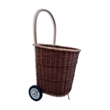 Vintage wicker log basket on vintage wheels