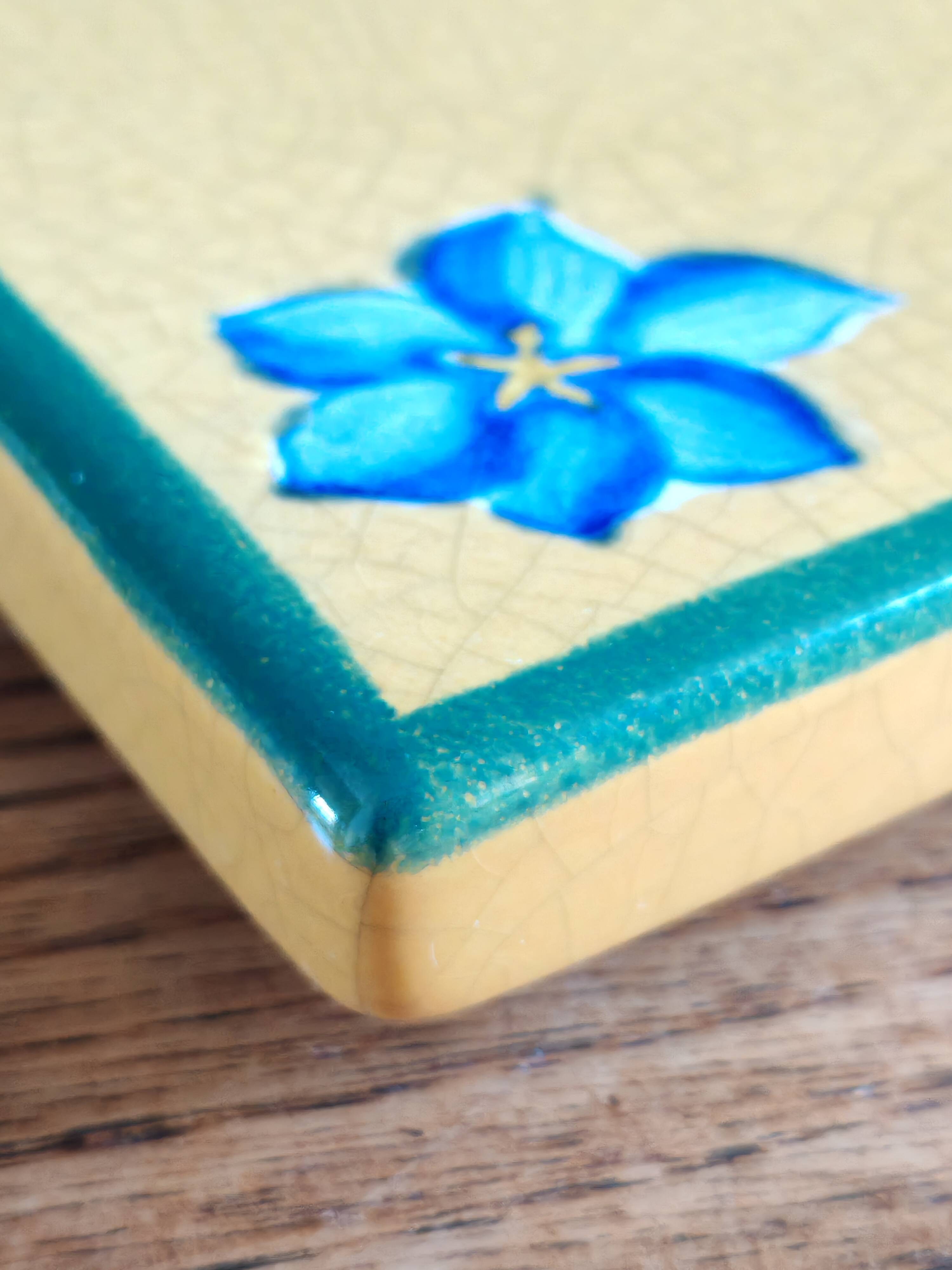 Yellow glazed ceramic trivet signed l. drimmer