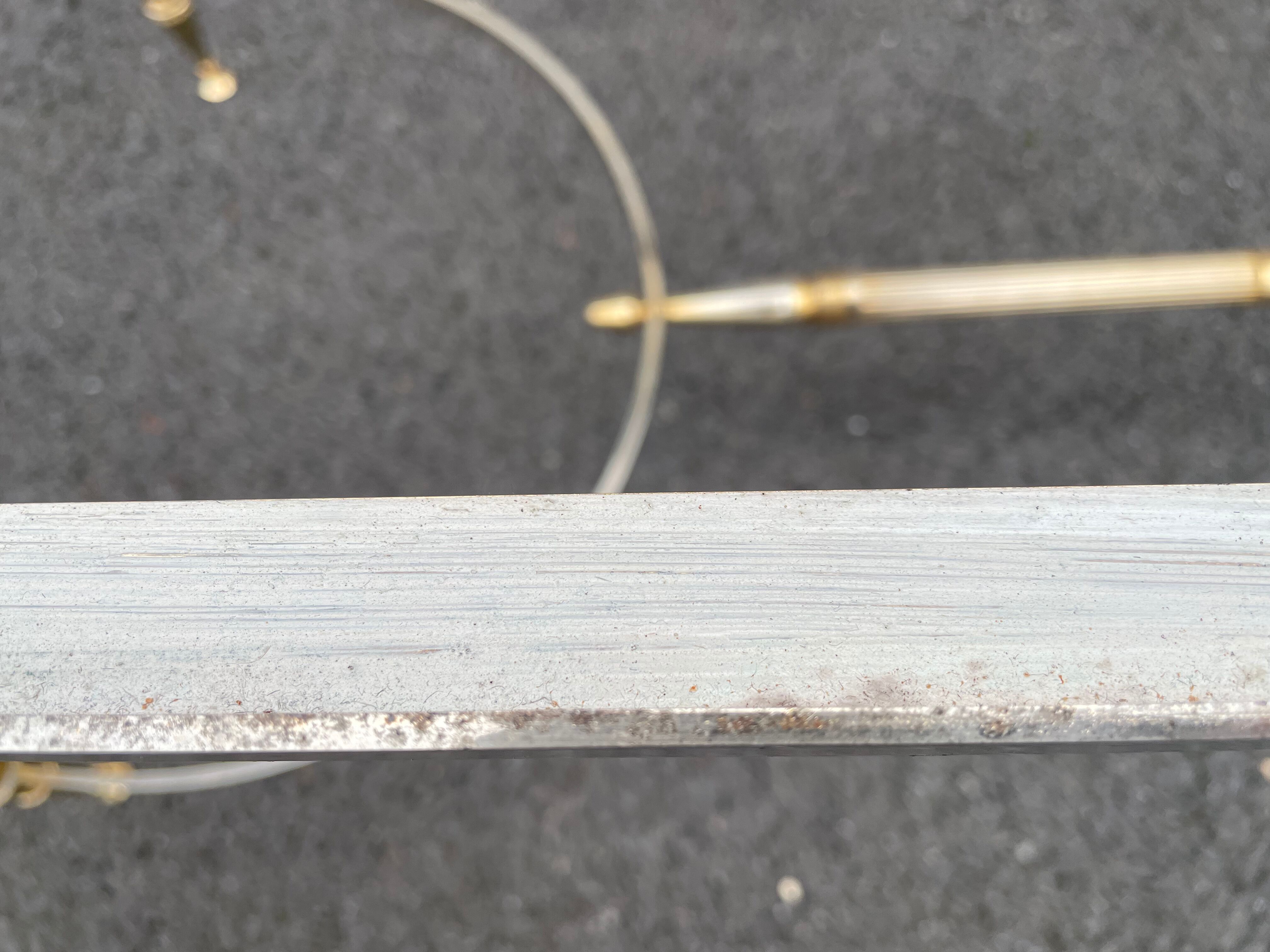 Coffee table in gilded brass and veined green marble