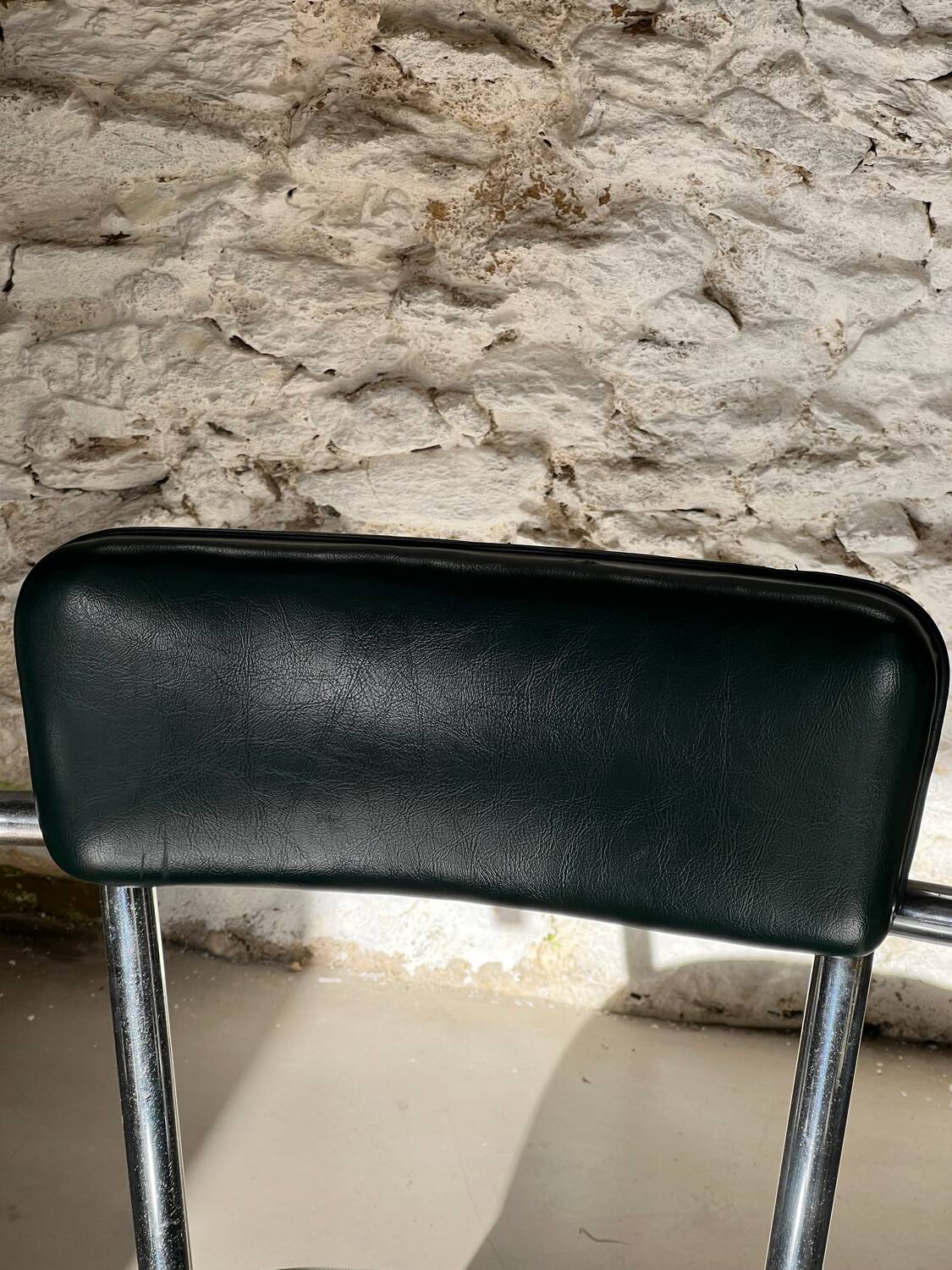 Pair of green vinyl and chrome armchairs, mid-century