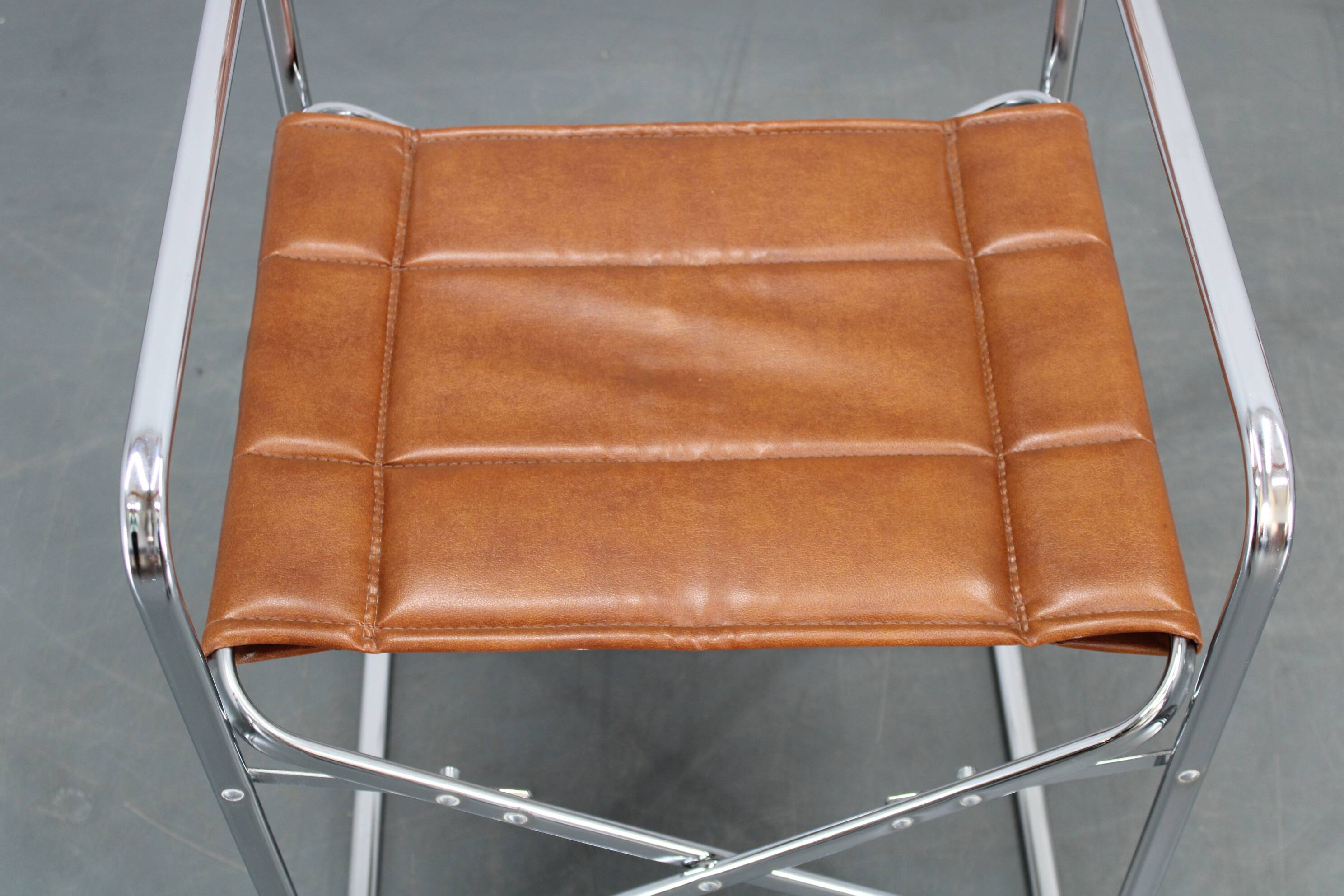 1970s pair of Italian folding chairs with leatherette upholstery