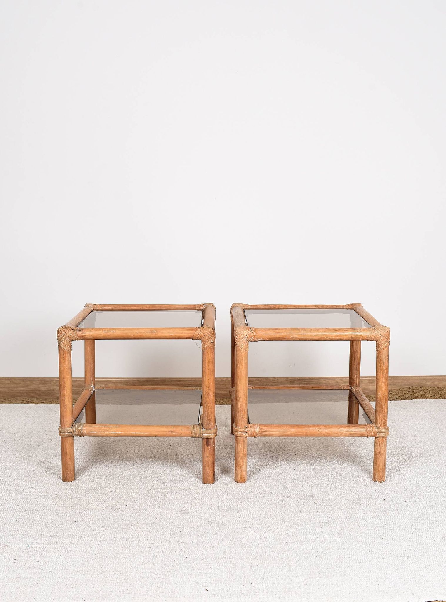 Pair of bedside tables or side tables, in rattan and smoked glass