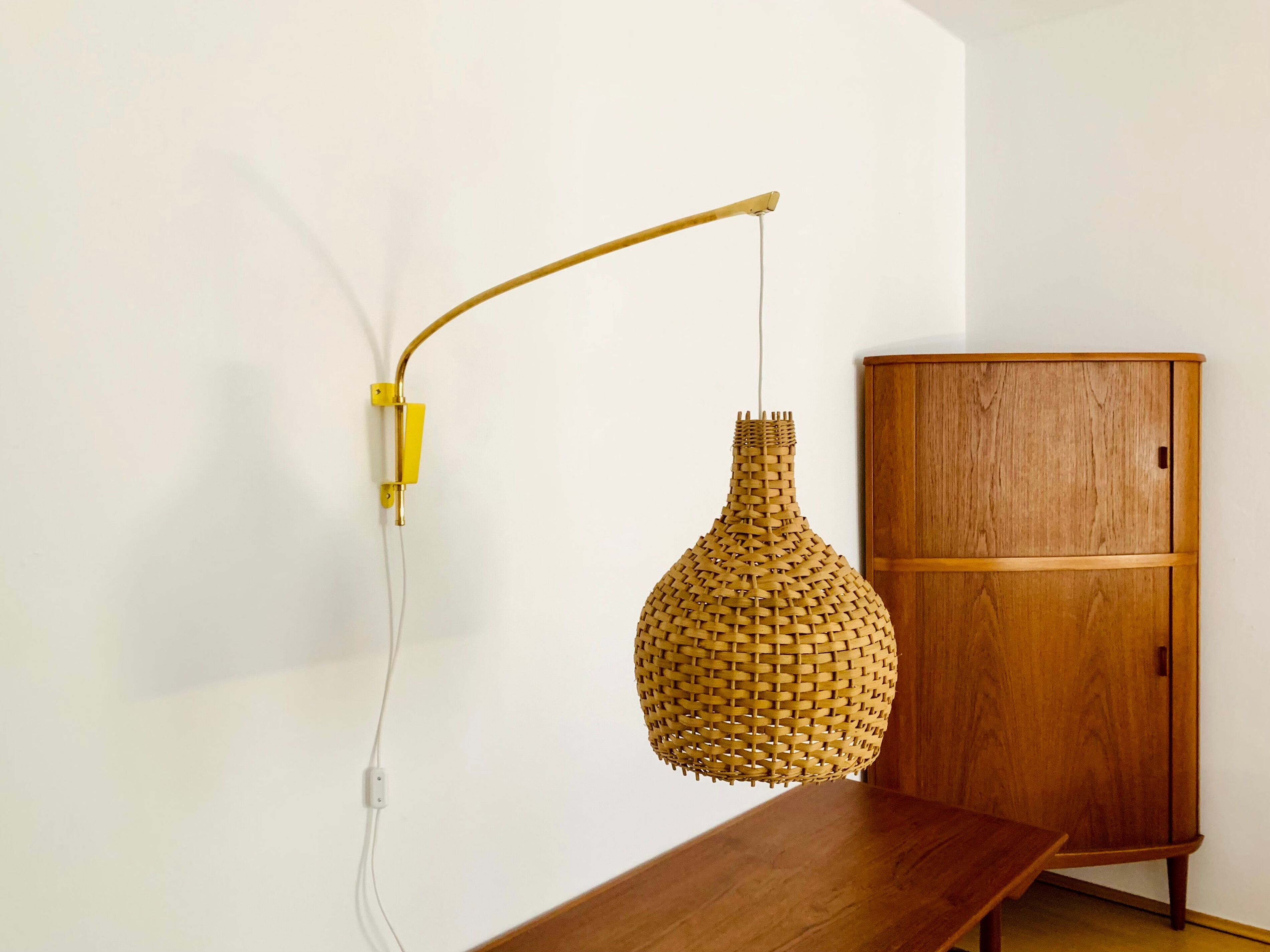 Adjustable Brass and Wicker Arc Sconce